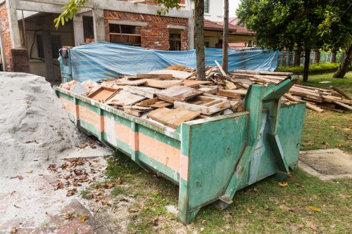 Photograph showing clutter and items awaiting removal during a house clearance